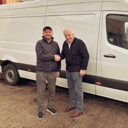 Steve shaking hands with Frederick Cooper bought high quality used van