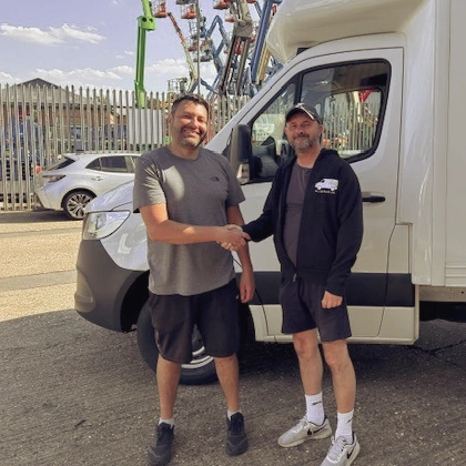 Steve shaking hands with  happy customer after selling van to Lara transport